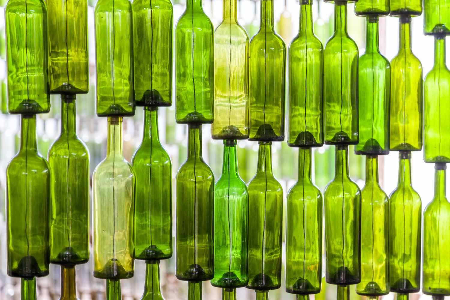 wall-of-recycled-glass-bottles-1205280268-5a37516eddf54b949433c2cea1ffc270.jpg