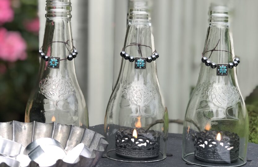 Glass-bottle-centrepiece-tealights-and-matches-2-833x540.jpg