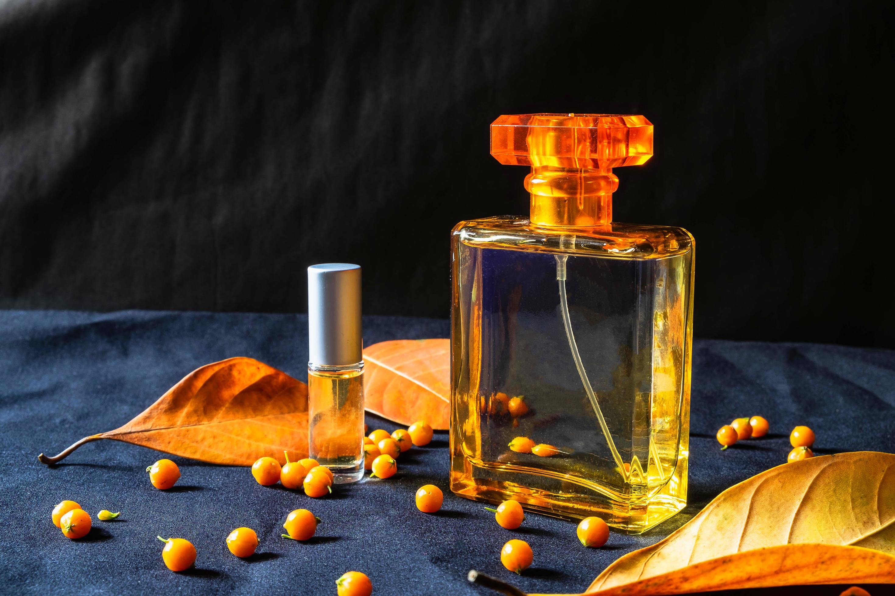 imgi_509_gold-perfume-bottle-and-orange-leaves-free-photo.jpg